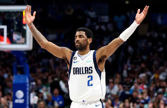 Dallas Mavericks guard Kyrie Irving celebrates a made shot.